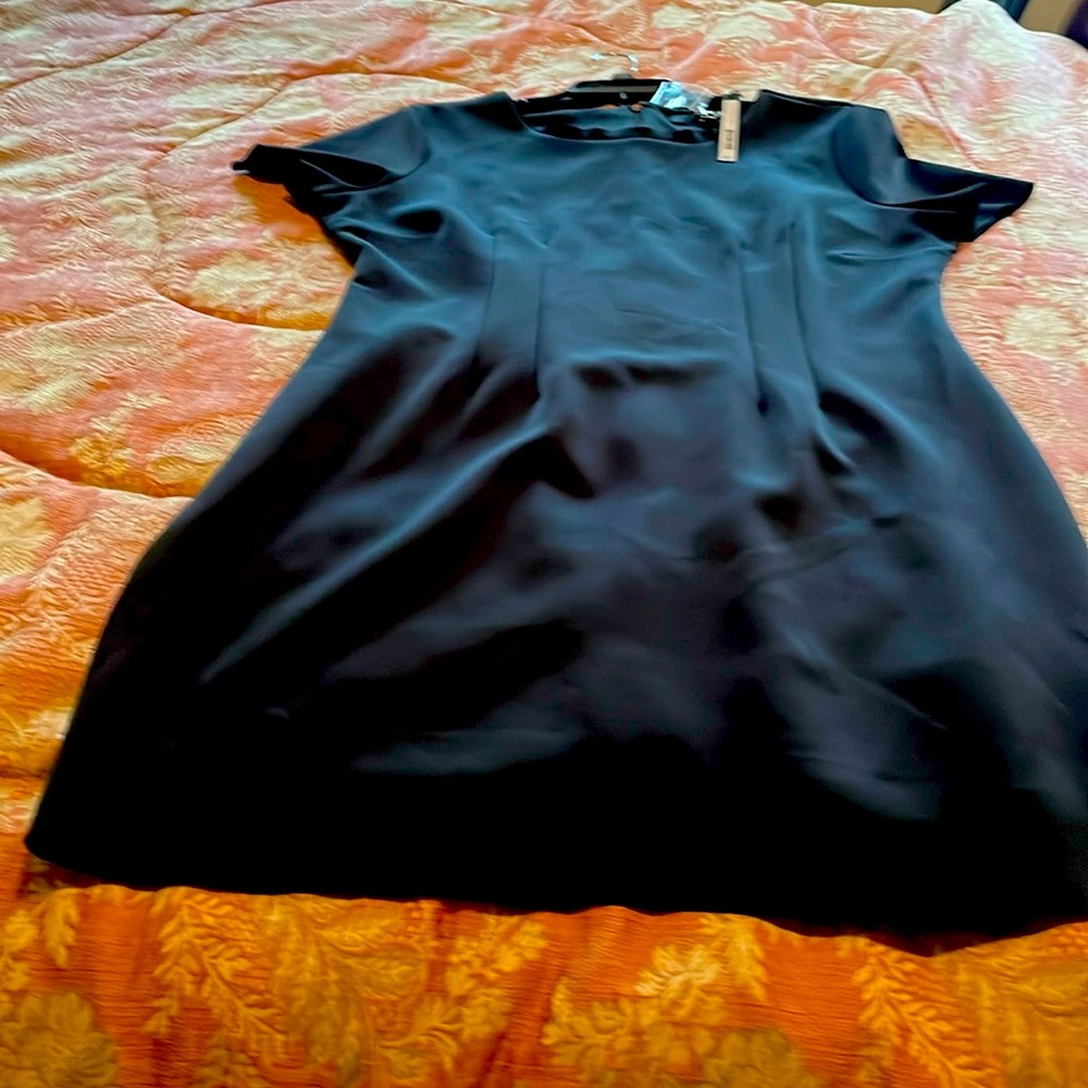 Black simple dress by Harve Benard NWT . Fabric is crepe. Below knee.